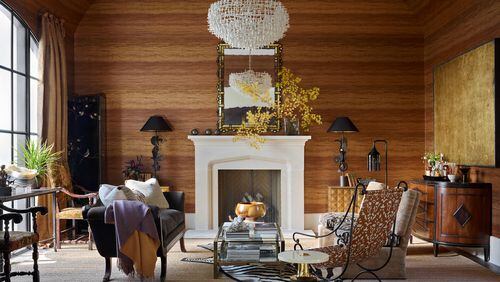 Natural light, a gold-framed mirror and a dramatic chandelier balance the brown in this handsome room from Carter Kay Interiors.
(Courtesy of Carter Kay Interiors / Emily Followill)