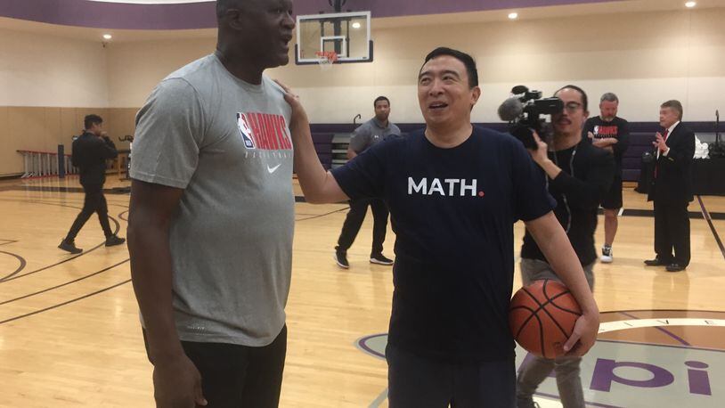 Dominique Wilkins and Andrew Yang on the court Monday.