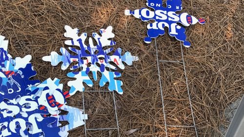 Campaign signs for Karen Handel and Jon Ossoff were cut into snowflakes and placed around Dunwoody.