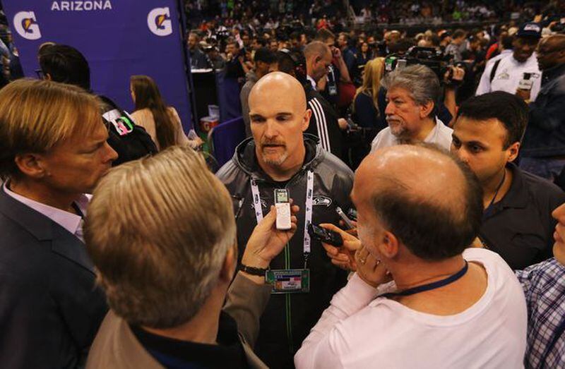 Defensive coordinator Dan Quinn of the Seattle Seahawks, here speaking to media members Tuesday at Super Bowl Media Day, is considered the Falcons’ choice to be their next head coach. (Photo by Elsa/Getty Images)