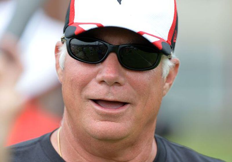 Falcons head coach Mike Smith talks with the media during the minicamp. Atlanta Falcons players workout during the second day of mini-camp at the team's facilities in Flowery Branch, Wednesday, June 18, 2014. KENT D. JOHNSON/KDJOHNSON@AJC.COM
