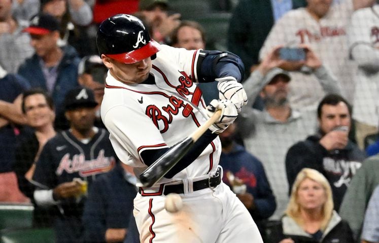 Atlanta Braves third baseman Austin Riley (27) hits an RBI single against the Philadelphia Phillies during the sixth inning of game two of the National League Division Series at Truist Park in Atlanta on Wednesday, October 12, 2022. (Hyosub Shin / Hyosub.Shin@ajc.com)