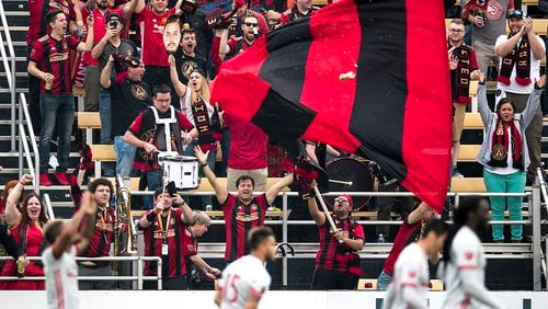 Atlanta United supporters celebrate their team’s goal against the Columbus Crew on Saturday, Feb. 18, 2017 in Charleston. (Photo by Alex Holt)