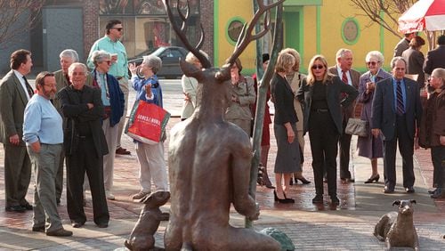 The controversial 'buckman' statue is dedicated Friday, Feb. 29, 1999, at Buckhead Park. (NICK ARROYO/AJC File)