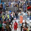 Travelers move through Hartsfield-Jackson Atlanta International Airport ahead of Memorial Day weekend, Friday, May 24, 2024, in Atlanta. Hartsfield-Jackson had a record number of passengers at security checkpoints as Memorial Day travel ramps up. (Hyosub Shin / AJC)