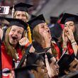 Graduates celebrate at Sanford Stadium during the University of Georgia spring commencement in Athens on Friday, May 10, 2024. (Arvin Temkar / AJC)