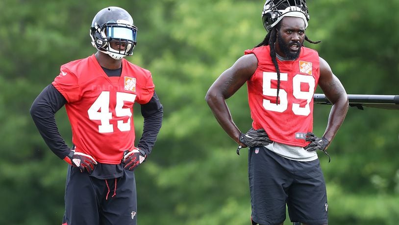 Linebackers Deion Jones (left) and De'Vondre Campbell are often in the same frame when on the field - or off. (Curtis Compton/ccompton@ajc.com)