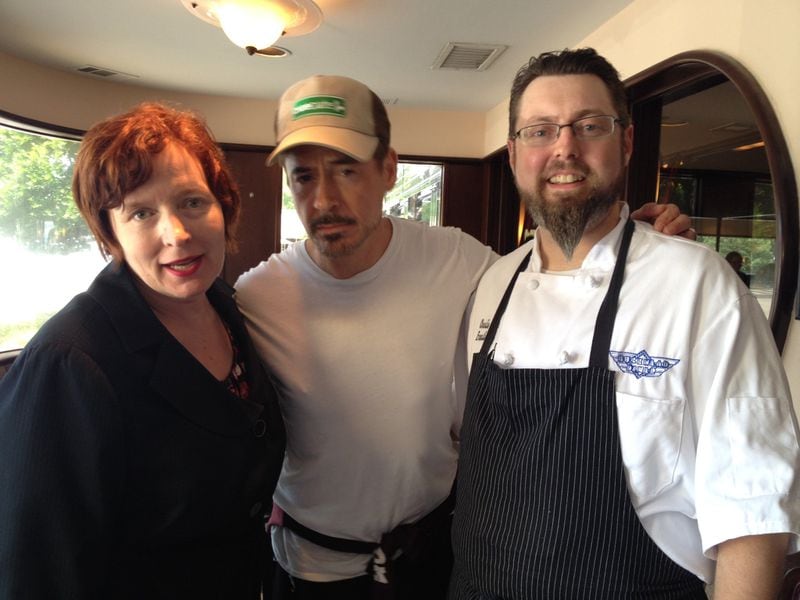 Robert Downey Jr. with Buckhead Diner general manager Maureen Baker and executive chef Charlie Schwab. CONTRIBUTED PHOTO