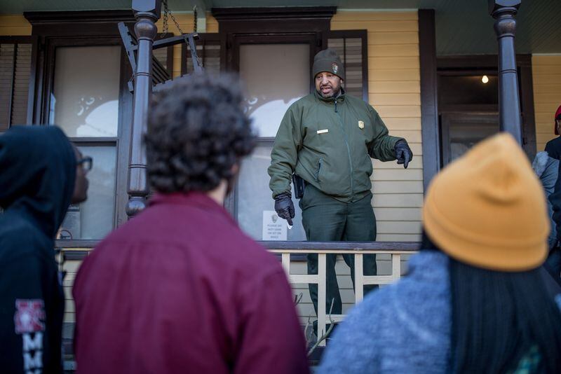 National Park Service ranger Marty Smith talks to visitors at the birthplace of the Rev. Martin Luther King Jr. in Atlanta on Jan. 20, 2020. (BRANDEN CAMP / SPECIAL TO THE AJC)