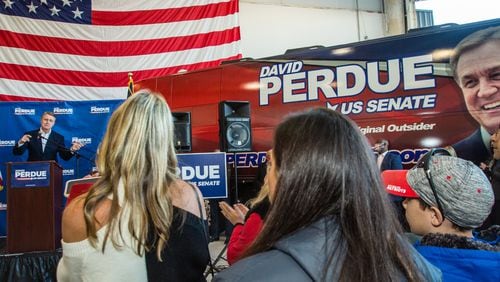 Senator David Perdue holds a rally at Peachtree DeKalb Airport on  Nov 2, 2020.  (Jenni Girtman for The Atlanta Journal-Constitution)