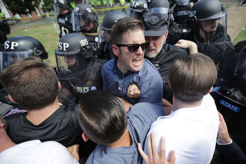 White nationalist Richard Spencer (C) and his supporters clash with Virginia State Police in Emancipation Park after the "Unite the Right" rally was declared an unlawful gathering August 12, 2017 in Charlottesville, Virginia. Hundreds of white nationalists, neo-Nazis and members of the "alt-right" clashed with anti-fascist protesters and police as they attempted to hold a rally in Emancipation Park, where a statue of Confederate General Robert E. Lee is slated to be removed. (Photo by Chip Somodevilla/Getty Images)