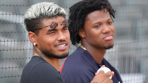 Atlanta United striker Josef Martinez (left) plays with a baseball as he talks with Atlanta Braves center fielder Ronald Acuna Jr. during a team practice ahead of Game 1 of best-of-five National League Division Series against the St. Louis Cardinals at SunTrust Park on Wednesday, October 2, 2019. (Hyosub Shin / Hyosub.Shin@ajc.com)