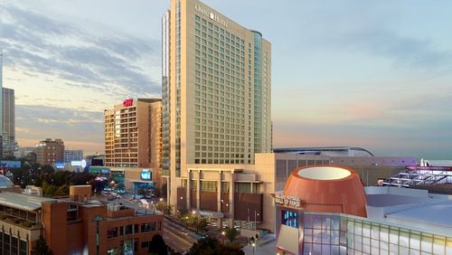 Dallas-based Omni Hotels & Resorts said Thursday it has purchased Time Warner's 50 percent stake in downtown Atlanta's Omni Hotel at CNN Center.