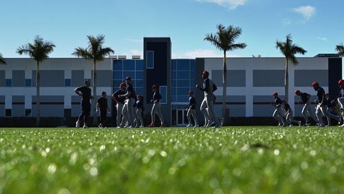 Atlanta Braves pitchers warm up during spring training baseball workouts at CoolToday Park, Wednesday, February, 14, 2024, in North Port, Florida. (Hyosub Shin / Hyosub.Shin@ajc.com)