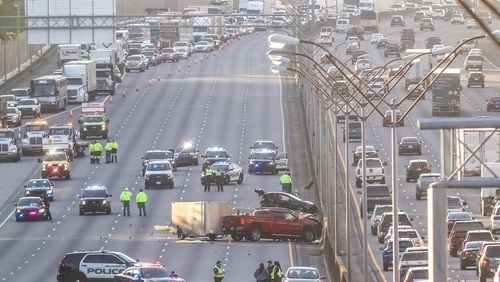 Cobb County commuters experienced gridlock conditions in both directions after two people were killed Tuesday in a multivehicle wreck on I-75 North.