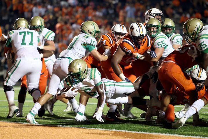 August 20, 2021 - Kennesaw, Ga: Buford running back Victor Venn (6) scores a rushing touchdown during the second half against North Cobb at North Cobb high school Friday, August 20, 2021 in Kennesaw, Ga.. Buford won 35-27. JASON GETZ FOR THE ATLANTA JOURNAL-CONSTITUTION
