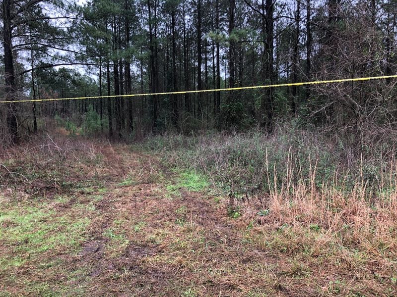 Crime scene tape marks the location where Anitra Gunn’s body was found Tuesday afternoon in a wooded area near the Crawford-Peach county line. 