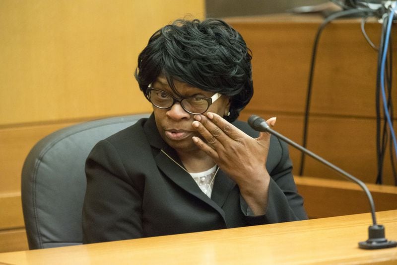 Witness Elaine Williams gets emotional as she testifies about her relationship with Diane McIver during the second day of the Tex McIver murder trial in Fulton County Superior Court in Atlanta on Wednesday, March 14, 2018. Williams is a legal assistant for U.S. Enterprises, where Diane McIver was president. (ALYSSA POINTER/ALYSSA.POINTER@AJC.COM)
