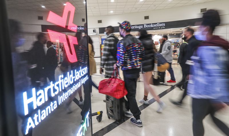 Thanksgiving travelers contributed to Hartsfield-Jackson International Airport regaining its world busiest airport designation. Hartsfield-Jackson’s passenger counts in 2021 were up 76.4% from 2020, but still down nearly one-third from 2019. Since the retreat of the omicron variant earlier this year, domestic traffic has been nearing 2019 levels. ( John Spink / John.Spink@ajc.com)

