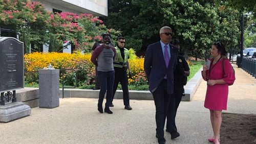 Georgia U.S. Rep. Hank Johnson, D-Lithonia, on the right, is arrested after participating in a voting rights demonstration outside a Senate office building on Capitol Hill in Washington on Thursday, July 22, 2021. (Tia Mitchell/The Atlanta Journal-Constitution)