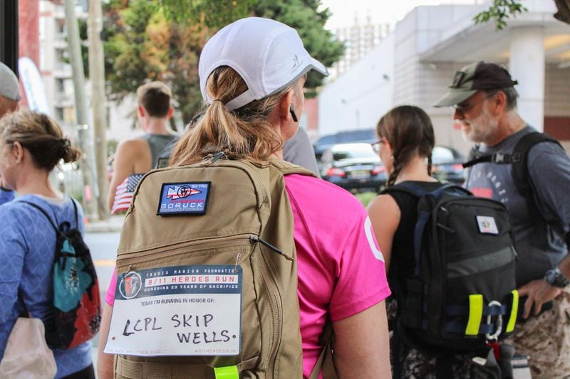A runner at the 9/11 Heroes Run participates in honor of a fallen hero LCPL Skip Wells. 
Courtesy of the Travis Manion Foundation.
