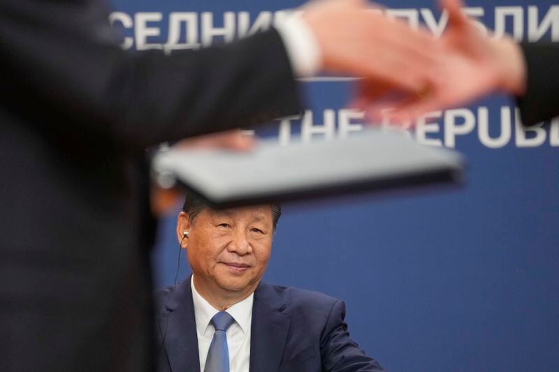 Chinese President Xi Jinping looks on as documents are exchanged after the signing of an agreement at the Serbia Palace, in Belgrade, Serbia, Wednesday, May 8, 2024. (AP Photo/Darko Vojinovic)