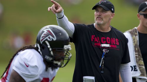 Dan Quinn gives instructions during Wednesday's training camp session.