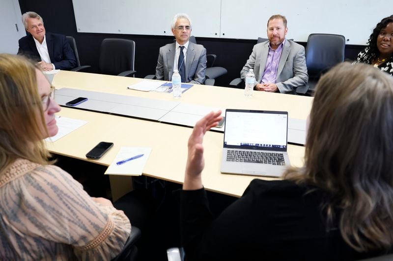 Dr. Ravi Thadhani (second left), vice president for health affairs at Emory University, listens to AJC health reporter Ariel Hart during an editorial board meeting at AJC’s headquarters in Dunwoody on Monday, August 14, 2023.
Miguel Martinez /miguel.martinezjimenez@ajc.com

