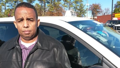 Mohamed Hussein, an Atlanta taxi driver who has an economics degree, said he spent $53,000 ona taxi “medallion” that might only be worth about $10,000 now, due to the rise of ride-share services and the city’s approach to regulation. MATT KEMPNER / AJC