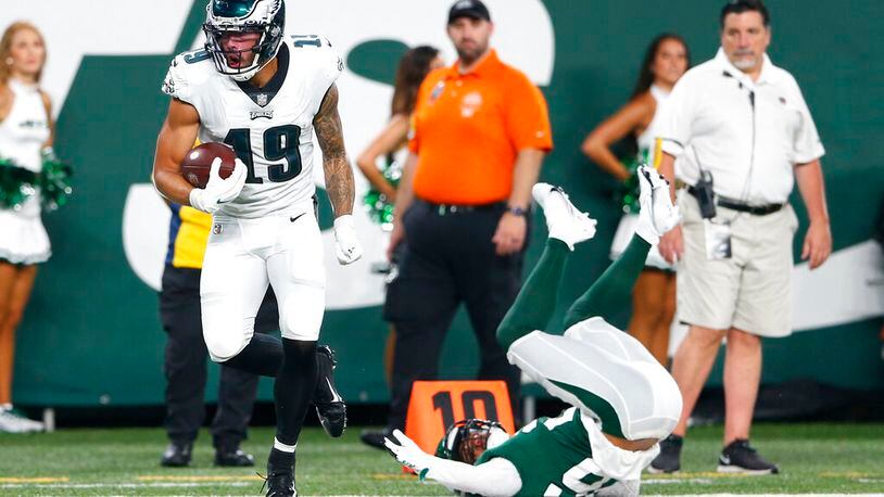 Philadelphia Eagles' J.J. Arcega-Whiteside (19) breaks a tackle by New York Jets' Elijah Campbell (26) to score a touchdown during the first half of an NFL preseason football game Friday, Aug. 27, 2021, in East Rutherford, N.J. (AP Photo/Noah K. Murray)