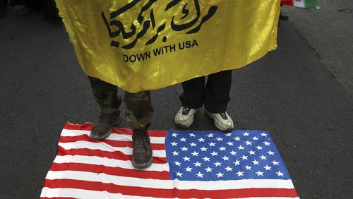 Demonstrators set fire to a rendition of the U.S. flag during a rally in front of the former U.S. Embassy in Tehran, Iran, on Monday. Reviving decades-old cries of "Death to America," Iran  marked the 40th anniversary of the 1979 student takeover of the U.S. Embassy in Tehran and the 444-day hostage crisis that followed as tensions remain high over the country's collapsing nuclear deal with world powers.