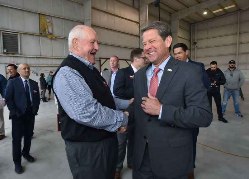 November 5, 2018 Atlanta - Agriculture Secretary Sonny Perdue and GOP gubernatorial candidate Brian Kemp share a smile ahead of Putting Georgians First Fly Around a day before the election day at Peachtree DeKalb Airport on Monday, November 5, 2018. HYOSUB SHIN / HSHIN@AJC.COM