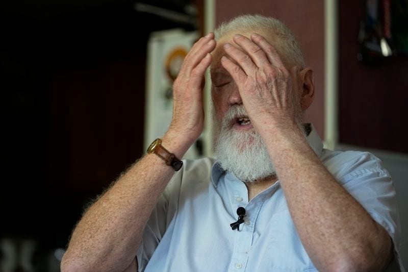 Dean Kahler, who was shot and paralyzed at Kent State University on May 4, 1970, recounts wiping tear gas from his eyes that day, during an interview in his home Thursday, May 2, 2024, in Plain Township, Ohio. (AP Photo/Sue Ogrocki)