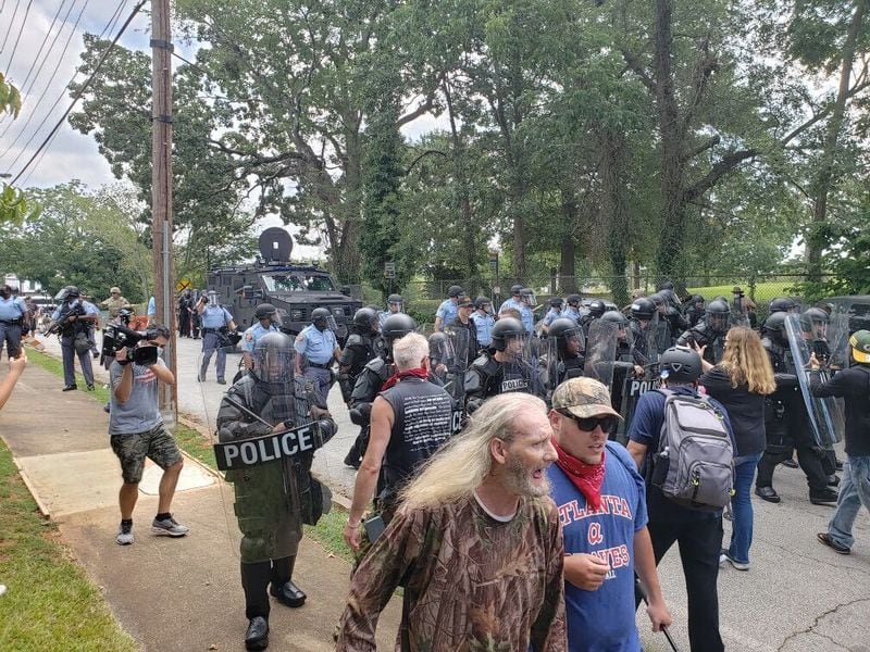 Saturday, Aug. 15, 2020, Stone Mountain -- Police move the streets of Stone Mountain to disperse protesters.