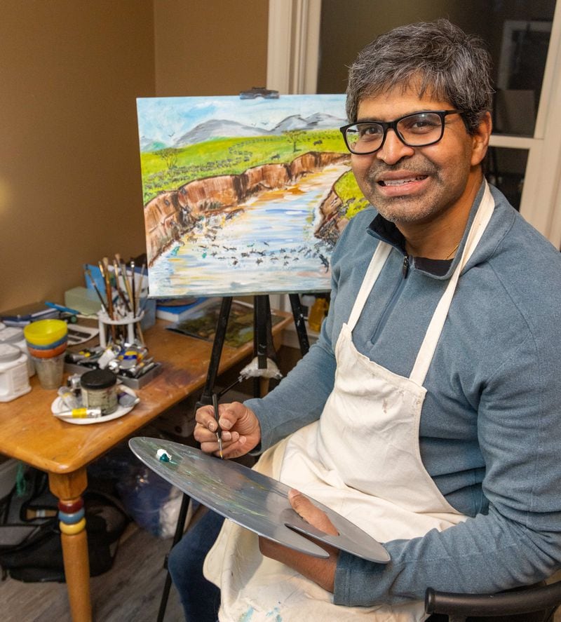 Dr. Sahir Shroff paints in his studio at his Marietta home. 
PHIL SKINNER FOR THE ATLANTA JOURNAL-CONSTITUTION