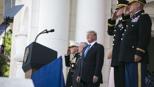 From left: Joint Chiefs Chairman Gen. Joseph Dunford, Defense Secretary Jim Mattis, and President Donald Trump during a Memorial Day ceremony at Arlington National Cemetery in Arlington, Va., May 29, 2017. On Wednesday, Trump announced the government would not “accept or allow” transgender people to serve in the U.S. military. (Al Drago/The New York Times)