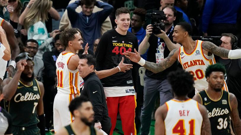 Atlanta Hawks guard Trae Young (11) is congratulated after the team's win over the Boston Celtics in Game 5 in a first-round NBA basketball playoff series Tuesday, April 25, 2023, in Boston. (AP Photo/Charles Krupa)