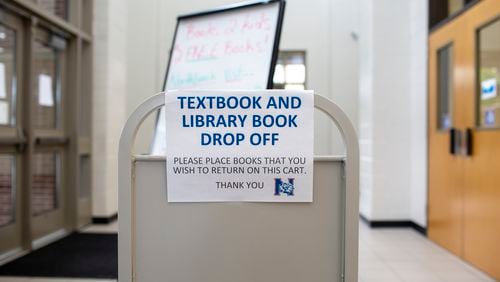 A textbook drop-off is seen at Northbrook Middle School in Suwanee, Georgia, in this July 8, 2020 file photo. State lawmakers are considering a bill that would revise the process for banning school library books and other materials. (REBECCA WRIGHT FOR THE ATLANTA JOURNAL-CONSTITUTION)