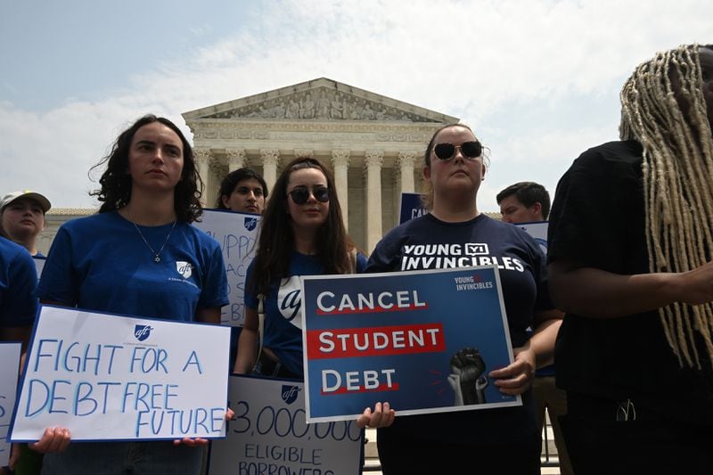 
Demonstrators in favor of canceling student debt outside the Supreme Court in Washington, June 30, 2023. (Kenny Holston/The New York Times)
                      