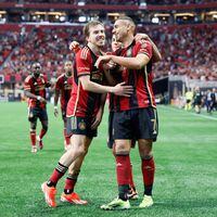 Atlanta United forward Giorgos Giakoumakis (7) celebrates with midfielder Saba Lobzhanidze (9) after scoring the first goal of his team during the first half against the Chicago Fire at Mercedes-Benz Stadium on Sunday, March 31, 2024.
 Miguel Martinez / miguel.martinezjimenez@ajc.com