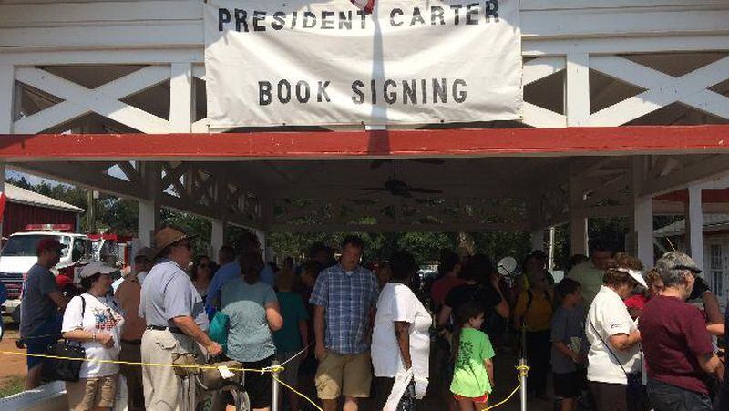 The line outside Billy Carter's gas station in Plains where Jimmy Carter signed books during the annual Peanut Festival last September. Jill Vejnoska/AJC