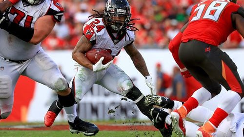 Falcons running back Devonta Freeman rushes during against the Tampa Bay Buccaneers  in the regular season finale Sunday, Dec. 29, 2019, at Raymond James Stadium in Tampa, Fla. Freeman finished the season with just under 600 yards rushing.