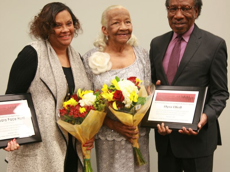 Dr. Maurice Daniels, right. wrote a book about three Black women who sued to integrate Georgia State in 1959. He is shown here with one of them, Myra Elliott, center, and the daughter of the late Barbara Pace Hunt, Crystal Freeman, left.