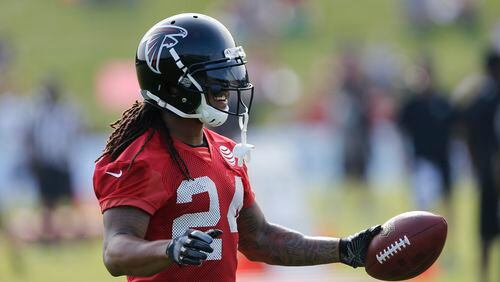 Atlanta Falcons running back Devonta Freeman (24) reacts during NFL football training camp Thursday, July 27, 2017, in Flowery Branch, Ga. (AP Photo/John Bazemore)