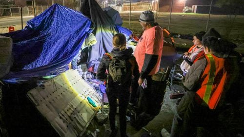 A group of volunteers and staff from supporting agencies participated in the "point in time" count, a practice mandated by the federal government that tallies people who were homeless on one night in January of each year. Jason Getz / Jason.Getz@ajc.com