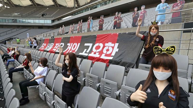 Cheering mannequins are installed at the empty spectators' seats before the start of a soccer match between FC Seoul and Gwangju FC May 17, 2020, at the Seoul World Cup Stadium in Seoul, South Korea.