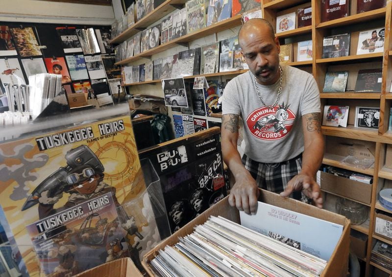 Caesar Ramirez puts special pricing on LPs for Record Store Day. Local independent record store Criminal Records, located in Little Five Points, will participate in the 10th annual Record Store Day on April 22 with more than 20 other metro Atlanta businesses. BOB ANDRES / BANDRES@AJC.COM