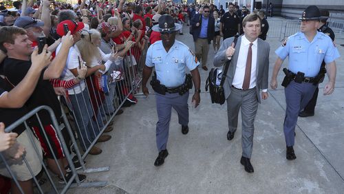 Georgia coach Kirby Smart gives the thumbs up as Georgia arrives at EverBank Field during the Dawg Walk before an NCAA college football game against Florida, Saturday, oct. 28,, 2017, in Jacksonville, Fla. (Curtis Compton/Atlanta Journal-Constitution via AP)