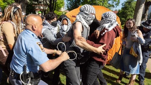 Police arrest Pro-Palestinian protestors who set up an encampment at the Emory Campus in Atlanta on Thursday, April 25, 2024. (Arvin Temkar / AJC)