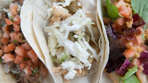 Short rib, fried calamari and fried chicken tacos at Verde Taqueria. (BECKY STEIN/special)